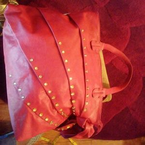 Red handbag with gold stones on the outsidees
